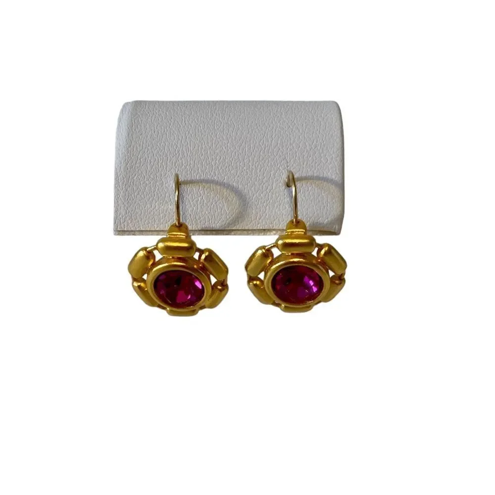 Beautiful pink stone & bright yellow gold toned huggie hoops.